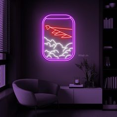 a neon sign that is on the side of a wall in a room with a chair