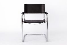 a black leather and chrome chair on a white background