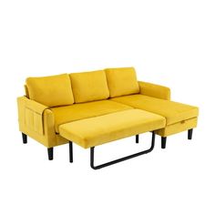 a yellow couch and ottoman sitting next to each other