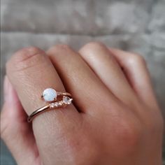 This White Opal Ring Will Be A Great Addition To Your Jewelry Box! The Rose Gold Band Of These Womens Rings Flawlessly Shows Off The Cubic Zirconia Stone And White Opal. These Stackable Rings For Women Create Such An Effortlessly Cool Look! Easily And Comfortably Fits All Finger Sizes. This Stacking Ring Is Plated In 14k Gold To Ensure A Long Lasting Brilliant Finish That Is Nickle Free, Lead Free, And Hypoallergenic. Gold Opal Stackable Ring, Adjustable Opal Stackable Rings, 14k Gold Stackable Opal Ring For Gift, Stackable Opal Ring, Round Shape, Adjustable Nickel-free Opal Ring, Double Chain Bracelet, Womens Rings, White Opal Ring, Stone Dangle Earrings