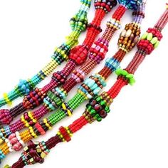 multicolored beaded necklaces are displayed on a white background