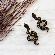 Whether it's spooky season or just a Saturday night our Moon Phases Snake Hoop Earrings are sure to turn heads!These earrings were laser cut on basswood then hand painted for you! All our jewelry is sealed with a topcoat so they will last for years to come.Hoops are hypoallergenic, nickel free gold plated alloy.Size: 2.25" x 1" Cactus Earrings, Hand Painted Earrings, Halloween Style, Snake Earrings, Gold Snake, Halloween Fashion, Body Jewellery, Jewelry Earrings Hoops, Moon Phases