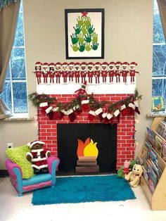 a living room decorated for christmas with stockings on the fire place and decorations around the fireplace