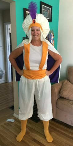 a woman in a costume standing on a hard wood floor