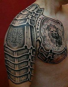 a man's chest with an armor tattoo on it