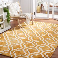 a yellow and white rug in a living room