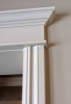 the corner of a white door frame