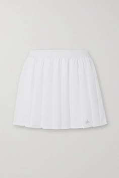 All of Alo Yoga's pieces are tested by the brand's in-house team to ensure they fit perfectly during your workout. This 'Varsity' tennis skirt is made from four-way stretch-jersey with classic pleats and an elasticated waistband. It's fitted with shorts underneath so you can move around easily on the court and has a handy hidden pocket. Casual Fitted Alo Yoga Tennis Skirt, Casual Fitted Tennis Skirt By Alo Yoga, White Athleisure Tennis Skirt For Sports, White Pleated Skirt In Athleisure Style, Sporty Pleated Tennis Skirt For Sports, White Athleisure Tennis Skort, Fitted Moisture-wicking Tennis Skirt, White Fitted Tennis Skirt For Athleisure, White Fitted Tennis Skirt Athleisure