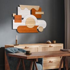 a wooden table with two chairs and a painting on the wall behind it in a living room