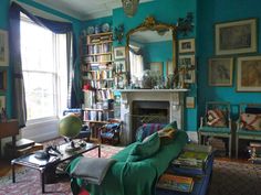 a living room filled with furniture and a fire place