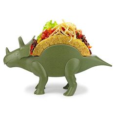 a green dinosaur shaped taco holder filled with food