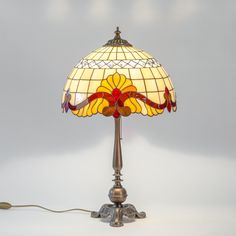 Beige stained glass Tiffany lamp with red inserts Tiffany Lampshade, Art Nouveau Table, Stained Glass Table, Bedside Reading Lamps, Spectrum Glass, Stained Glass Table Lamps, Modern Stained Glass, Tiffany Table Lamps, Office Lamp