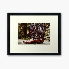 pair of red cowboy boots framed art print