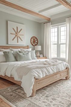 a large bed sitting in a bedroom on top of a wooden floor next to a window