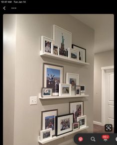 the wall is filled with pictures and frames