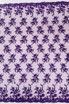 a purple and white lace with flowers on it