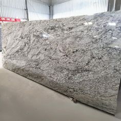 a large marble counter top in a warehouse