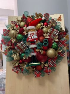 a christmas wreath with santa claus on it