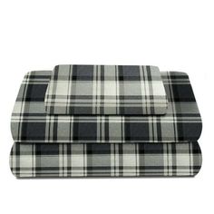 two black and white plaid bedspreads on top of each other, one is folded