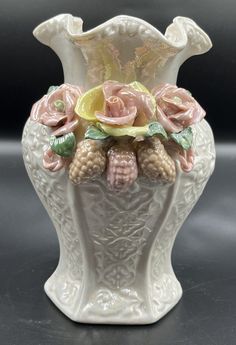 This is a beautiful medium-sized Capodimonte porcelain vase with an Italian style. It features a floral pattern with yellow and pink flowers, and an iridescent finish. The vase is perfect for displaying flowers and adding a decorative touch to any room. Yellow And Pink Flowers, Capodimonte Porcelain, Yellow And Pink, Porcelain Vase, Italian Style, Ceramic Vase, Pink Flowers, Floral Pattern, Porcelain