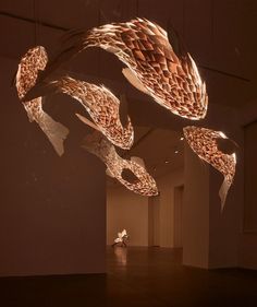 an abstract sculpture is suspended from the ceiling