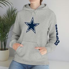 Show off your Dallas Cowboys Pride!!  This unisex heavy blend hooded sweatshirt is relaxation itself. Made with a thick blend of cotton and polyester, it feels plush, soft and warm, a perfect choice for any cold day. In the front, the spacious kangaroo pocket adds daily practicality while the hood's drawstring is the same color as the base sweater for extra style points. .: 50% cotton, 50% polyester .: Medium-heavy fabric (8.0 oz/yd² (271 g/m .: Classic fit .: Tear-away label .: Runs true to size Relaxed Fit Fan Apparel Sweatshirt For Winter, Fleece Hoodie For Fan Gear, Winter Sports Events Fan Apparel Hoodie, Winter Sports Events Fan Hoodie, Winter Fan Apparel Hoodie For Sports Events, Winter Sports Event Fan Apparel Hoodie, Cotton Hoodie For Fan Gear, Winter Fleece Sweats For Sports Events, Winter Fleece Sweatshirt For Fan Gear