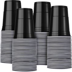 black and white striped cups are stacked on top of each other