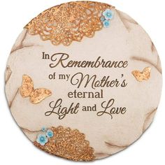 a ceramic plaque with the words, in remembrance of my mother's eternal light and love