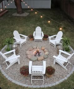 a fire pit with chairs around it