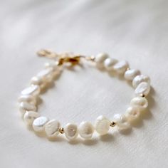 Our Kailani Bracelet is a beautiful beachy bracelet that is perfect to style everyday for this summer season. Made out of our freshwater nugget pearls and gold beaded accents, everyone will be asking you where you got your modern pearl bracelet. Complete a Mommy-and-Me look with the Kailani Child Pearl Bracelet! Materials: freshwater nugget pearl Length: approximately 8" including extender Beachy Bracelets, Bracelet Materials, Chic Accessories, Good Enough, Beauty Cosmetics, Summer Season, Mommy And Me, Gold Beads