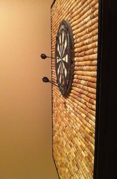 an image of a clock on the side of a door and another photo of a cat