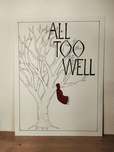 an all too well poster with a red scarf hanging from it's tree branch