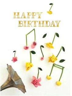 a birthday card with music notes and flowers in the shape of musical notes on a white background