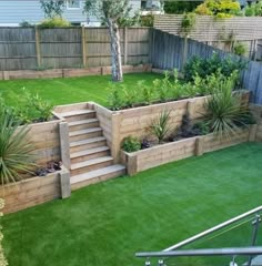 an outdoor garden with grass and wooden steps