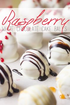 white chocolate cake balls with raspberry on top and the words raspberry written above them