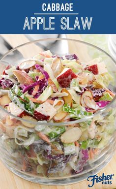 a salad in a glass bowl with the title cabbage apple slaw on top and an image