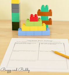 legos and building blocks sitting on top of a wooden table next to a pencil