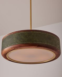 a wooden light fixture hanging from a ceiling