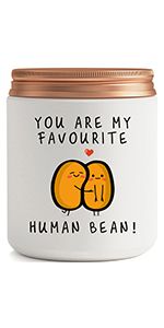 a white jar with an image of two oranges on it and the words you are my favorite human bean