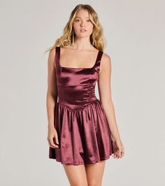 Your charm and this satin skater dress will make you the most captivating one at the school dance or banquet! Featuring a square neckline and delicate shoulder straps, this dress is designed to flatter your figure. The low back with a tie adds a touch of playfulness, while the drop waist seam and skater silhouette create a stunning shape. Complete the look in high heels and jewelry!Fit & FeaturesSatin fabric lined with stretchy knitSquare necklineShoulder strapsLow back with tie, zipper and Satin Square Neck Mini Dress For Date Night, Satin Mini Dress With Square Neck For Date Night, Fitted Satin Dress With Square Neck For Prom, Fitted Satin Prom Dress With Square Neck, Summer Satin Dress With Square Neck, Prom Mini Dress With Corset Back And Square Neck, Satin Square Neck Prom Dress, Prom Dresses With Square Neck In Satin, Square Neck Satin Prom Dress