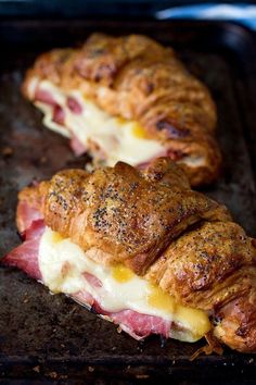 ham and cheese croissants on a baking sheet