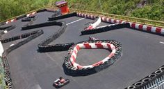 an aerial view of a race track with red and white stripes