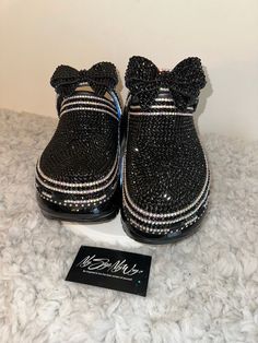 "MyStyleMyWay's  custom crocs are designed for the perfect outfit, that special occasion, and \"Just Because\" you love blinged out crocs.  In the display shown we designed a pair of \"BLACK MEGA CRUSH \"  adding high quality black rhinestones. 🎀 Each Rhinestone is individually and neatly placed to achieve the design.  🎀Rhinestones are added to the top portion of the shoe 🎀Bows are applied to the sports mode strap to this design to add cuteness and personality.  🎀This design do not have charms, charms can be added please contact us directly or visit our website www.MyStyleMyWay.co to view our charm selection.  🎀When making your purchase - You're making a purchase for the exact style shown. If you would like a different color rhinestone,  and or different charms please message us so we Mega Crush Crocs, Crush Crocs, Blinged Out Crocs, Shoe Bows, Bling Bows, Custom Crocs, Bow Birthday, Bling Shirts, Crocs Black