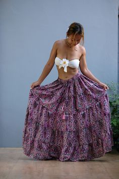 This beautiful Skirts with  made from lightweight cotton fabric. which perfectly fit to your festival, beach, summer vacation or just new addition to your wardrobe that will inspire you for your new street look! This Skirts is comfortable and relaxation for any occasion.      🪡🧵 MATERIAL : cotton breathable muslin This skirts will fit sizes Small to Large,  ( Not - XL ) 🌸 Waist : 24'' Stretching to 50'' ( 61 cm - 127 cm ) 🌸 Hips : up to 54" ( 137 cm ) 🌸 Length : 38" from waist to hem ( 96.52.cm ) Model is 5' 1" and 103 lbs.  * Accessories excluded ❤️ COLOR VARIATIONS Our clothes are hand-dyed in batches after they are sewn. ( The colour may different about 5-10 % from the real colour ) We aim for our colors to match our photos. We hope you love your new breathable threads.  CARE INSTR Hippie Flowy Wrap Skirt For The Beach, Beach Festival Skirt Bottoms, Flowy Hippie Wrap Skirt For Beach, Bohemian Mini Skirt For Beach, Bohemian Long Skirt For The Beach, Bohemian Skirt For Vacation, Bohemian Long Skirt For Beach, Summer Festival Ruffled Skirt, Purple Maxi Skirt For Summer Vacation