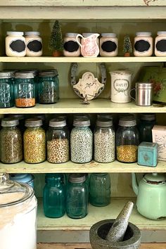 many jars and containers are on the shelves