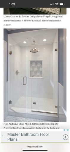 an image of a bathroom with white tile and glass shower doors on the bottom floor