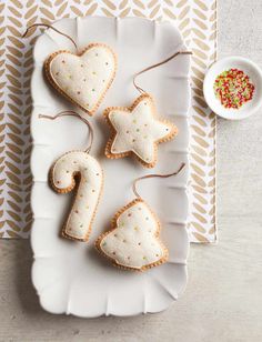 three cookies shaped like stars on a plate