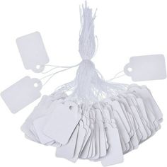 white tags and tags attached to strings on a white background with clippings for each tag