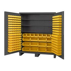 yellow bins are stacked on top of each other in a storage unit with black shelves