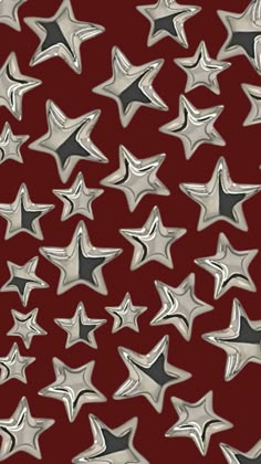 many silver stars on a red background